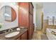 Bathroom with dark wood cabinets and granite countertop at 1330 Monte Lake Dr, Valrico, FL 33596