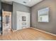 Bedroom with light wood floors, gray walls, and built in closet at 1330 Monte Lake Dr, Valrico, FL 33596