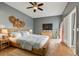 Main bedroom with a king-size bed and stylish decor at 1330 Monte Lake Dr, Valrico, FL 33596