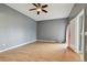 Simple bedroom with laminate wood flooring and ceiling fan at 1330 Monte Lake Dr, Valrico, FL 33596