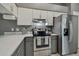 Modern kitchen with gray cabinets and white counters at 1330 Monte Lake Dr, Valrico, FL 33596