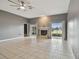 Living room with fireplace,water view, and tile flooring at 1330 Monte Lake Dr, Valrico, FL 33596