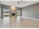 Spacious living room with tile flooring, fireplace, and sliding doors to a view at 1330 Monte Lake Dr, Valrico, FL 33596