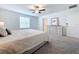 Spacious bedroom with king-size bed and dresser at 13455 Jamaica Plank Loop, Riverview, FL 33579