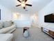 Cozy loft area with TV and comfortable seating at 13455 Jamaica Plank Loop, Riverview, FL 33579