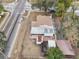 House with backyard, shed, and driveway visible from above at 1424 E Bougainvillea Ave, Tampa, FL 33612