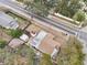 Aerial view of a house, detached shed, and yard at 1424 E Bougainvillea Ave, Tampa, FL 33612