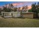 Backyard with shed and screened patio at 1424 E Bougainvillea Ave, Tampa, FL 33612