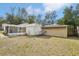 Backyard view with sheds and fence at 1424 E Bougainvillea Ave, Tampa, FL 33612