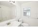 Clean bathroom, features a toilet, sink, and shower/tub combo at 1424 E Bougainvillea Ave, Tampa, FL 33612