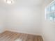 Empty bedroom with wood floors and a window at 1424 E Bougainvillea Ave, Tampa, FL 33612