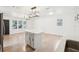 Modern kitchen with white cabinets and a large island at 1424 E Bougainvillea Ave, Tampa, FL 33612