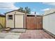 Tan storage shed with wooden gate at 1424 E Bougainvillea Ave, Tampa, FL 33612