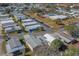 Aerial view of mobile home community with pool and parking at 148 Gull Aire Blvd, Oldsmar, FL 34677