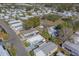 Aerial view of mobile home community with mature trees and paved roads at 148 Gull Aire Blvd, Oldsmar, FL 34677