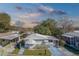 Aerial view of a white single story home in a community at 148 Gull Aire Blvd, Oldsmar, FL 34677