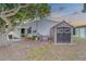 Back of house showing patio, shed and landscaping at 148 Gull Aire Blvd, Oldsmar, FL 34677