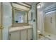 Neat bathroom with a vanity, mirror, and shower stall at 148 Gull Aire Blvd, Oldsmar, FL 34677