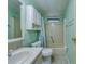 Bathroom with tub, toilet, vanity, and linen cabinet at 148 Gull Aire Blvd, Oldsmar, FL 34677