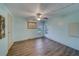 Simple bedroom with light walls and wood-look flooring at 148 Gull Aire Blvd, Oldsmar, FL 34677