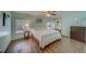 Main bedroom with wood-look floors and mirrored closet doors at 148 Gull Aire Blvd, Oldsmar, FL 34677