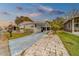 White single-story home with carport and landscaped yard at 148 Gull Aire Blvd, Oldsmar, FL 34677