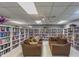 Community library with comfortable seating and bookshelves at 148 Gull Aire Blvd, Oldsmar, FL 34677