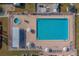 Aerial view of community pool with lounge chairs and spa at 148 Gull Aire Blvd, Oldsmar, FL 34677