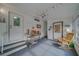 Relaxing screened porch with rocking chair and table at 148 Gull Aire Blvd, Oldsmar, FL 34677