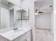 Bright bathroom with white vanity, quartz countertop and a view of bedroom at 1505 Chateaux De Ville Ct, Clearwater, FL 33764