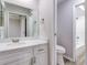 Updated bathroom with white vanity, quartz countertop and a shower/tub combo at 1505 Chateaux De Ville Ct, Clearwater, FL 33764