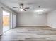 Bright living room with vinyl flooring and sliding glass doors at 1505 Chateaux De Ville Ct, Clearwater, FL 33764