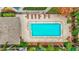 Community pool with surrounding patio furniture and landscaping at 1505 Chateaux De Ville Ct, Clearwater, FL 33764