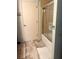 Bathroom with tub/shower combo and updated flooring at 1510 Palmer Ct, Palm Harbor, FL 34685