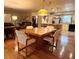 Dining room with hardwood floors and view into the kitchen at 1510 Palmer Ct, Palm Harbor, FL 34685