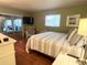 Main bedroom with hardwood floors, king bed and sliding doors to the outside at 1510 Palmer Ct, Palm Harbor, FL 34685