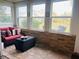 Red couch and wicker table on a sun-drenched patio at 1510 Palmer Ct, Palm Harbor, FL 34685