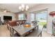 Bright dining room with view to the backyard at 15737 High Bell Pl, Bradenton, FL 34212