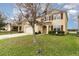 Two-story house with a tree in the front yard at 15737 High Bell Pl, Bradenton, FL 34212