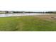 Peaceful backyard with a lake view and fire pit at 15737 High Bell Pl, Bradenton, FL 34212