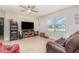 Living room with large TV and comfortable seating at 15737 High Bell Pl, Bradenton, FL 34212