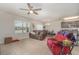 Living room with leather couches and ceiling fan at 15737 High Bell Pl, Bradenton, FL 34212