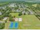 Wide aerial view of community, featuring tennis courts at 19106 Cellini Pl, Lutz, FL 33558