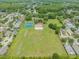 Aerial view of community with tennis courts and playground at 19106 Cellini Pl, Lutz, FL 33558