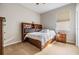 Well-lit bedroom with a double bed, nightstand, and dresser at 19106 Cellini Pl, Lutz, FL 33558