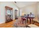 Living room with hardwood floors, piano, and display cabinets at 19106 Cellini Pl, Lutz, FL 33558