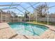 Relaxing screened-in pool area with brick pavers at 19106 Cellini Pl, Lutz, FL 33558