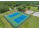 Community tennis courts with surrounding green space at 19106 Cellini Pl, Lutz, FL 33558