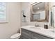 Small bathroom with a single vanity and a view of the toilet at 1950 Marlington Way, Clearwater, FL 33763