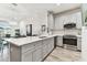 Modern kitchen with stainless steel appliances and white quartz countertops at 1950 Marlington Way, Clearwater, FL 33763